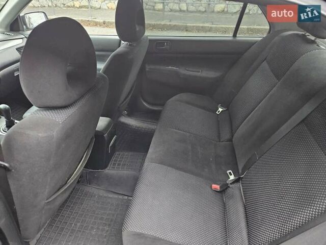 Черный Мицубиси Лансер, объемом двигателя 1.6 л и пробегом 152 тыс. км за 4999 $, фото 2 на Automoto.ua