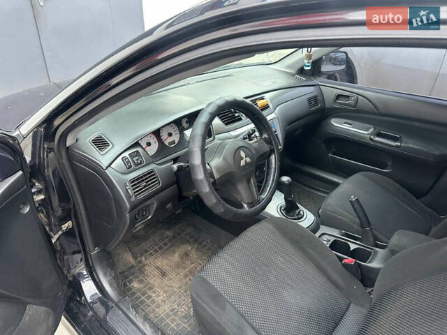 Черный Мицубиси Лансер, объемом двигателя 1.58 л и пробегом 290 тыс. км за 3000 $, фото 8 на Automoto.ua