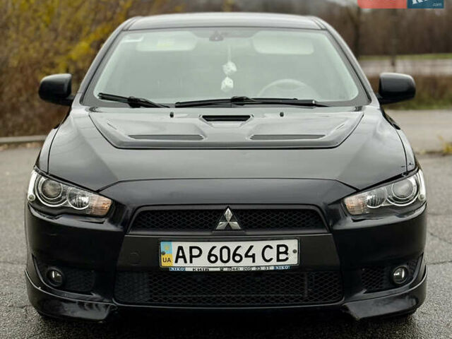 Черный Мицубиси Лансер, объемом двигателя 2 л и пробегом 215 тыс. км за 5500 $, фото 2 на Automoto.ua