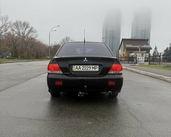 Чорний Міцубісі Lancer, об'ємом двигуна 1.58 л та пробігом 256 тис. км за 3700 $, фото 4 на Automoto.ua