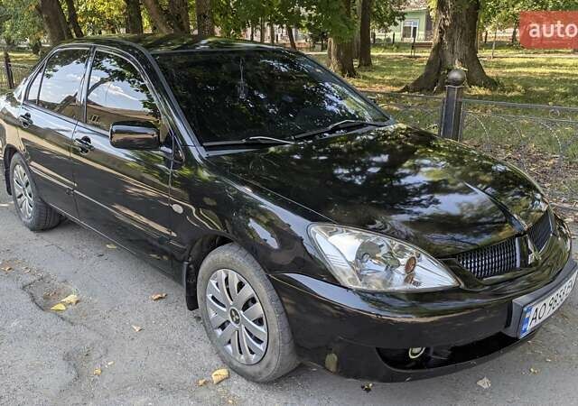 Черный Мицубиси Лансер, объемом двигателя 1.6 л и пробегом 366 тыс. км за 3500 $, фото 7 на Automoto.ua