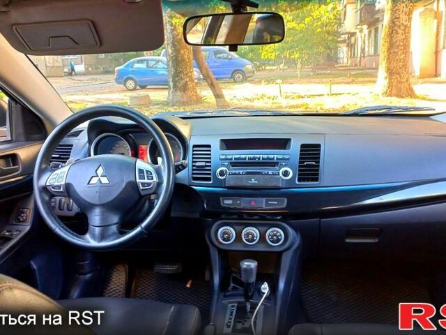 Черный Мицубиси Лансер, объемом двигателя 2 л и пробегом 290 тыс. км за 5800 $, фото 4 на Automoto.ua