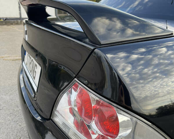 Чорний Міцубісі Lancer, об'ємом двигуна 2 л та пробігом 280 тис. км за 4600 $, фото 20 на Automoto.ua