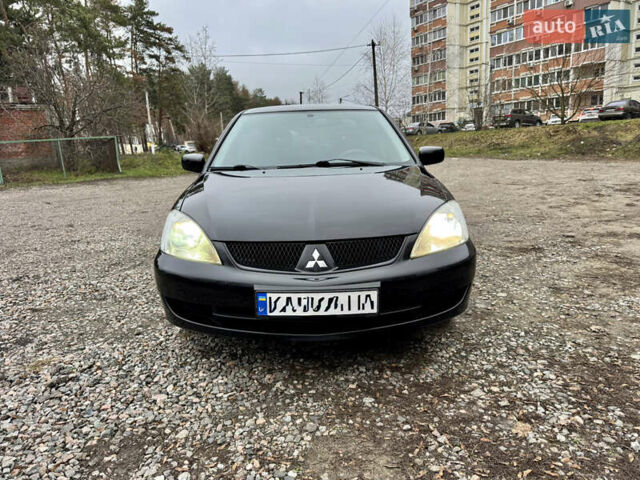 Черный Мицубиси Лансер, объемом двигателя 1.6 л и пробегом 216 тыс. км за 4990 $, фото 7 на Automoto.ua