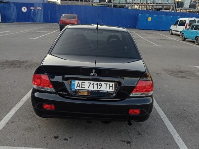 Черный Мицубиси Лансер, объемом двигателя 1.6 л и пробегом 301 тыс. км за 4300 $, фото 3 на Automoto.ua
