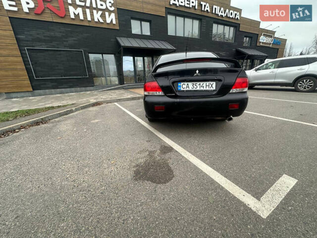 Черный Мицубиси Лансер, объемом двигателя 1.58 л и пробегом 290 тыс. км за 3000 $, фото 5 на Automoto.ua