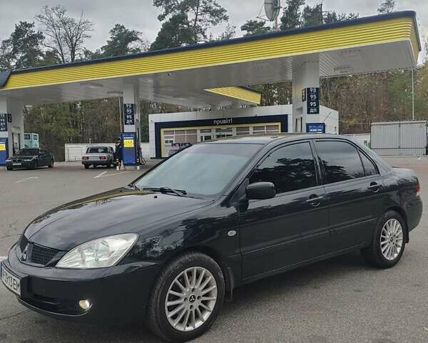 Чорний Міцубісі Lancer, об'ємом двигуна 1.58 л та пробігом 190 тис. км за 3750 $, фото 2 на Automoto.ua