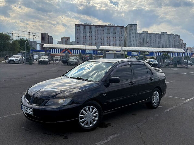 Черный Мицубиси Лансер, объемом двигателя 2 л и пробегом 250 тыс. км за 3850 $, фото 12 на Automoto.ua