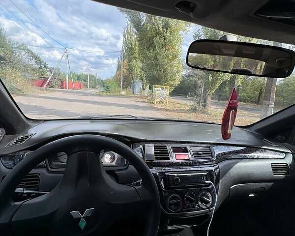 Черный Мицубиси Лансер, объемом двигателя 1.6 л и пробегом 244 тыс. км за 4100 $, фото 8 на Automoto.ua