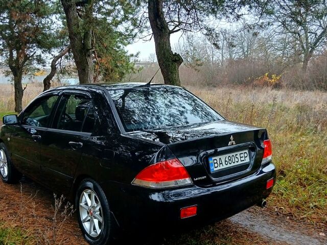 Чорний Міцубісі Lancer, об'ємом двигуна 1.6 л та пробігом 240 тис. км за 4700 $, фото 2 на Automoto.ua