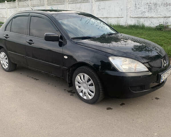 Черный Мицубиси Лансер, объемом двигателя 1.5 л и пробегом 248 тыс. км за 3200 $, фото 4 на Automoto.ua