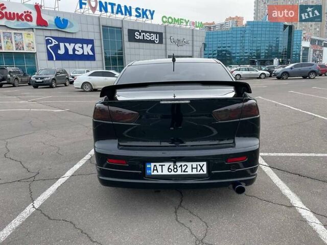 Черный Мицубиси Лансер, объемом двигателя 2 л и пробегом 246 тыс. км за 7500 $, фото 4 на Automoto.ua