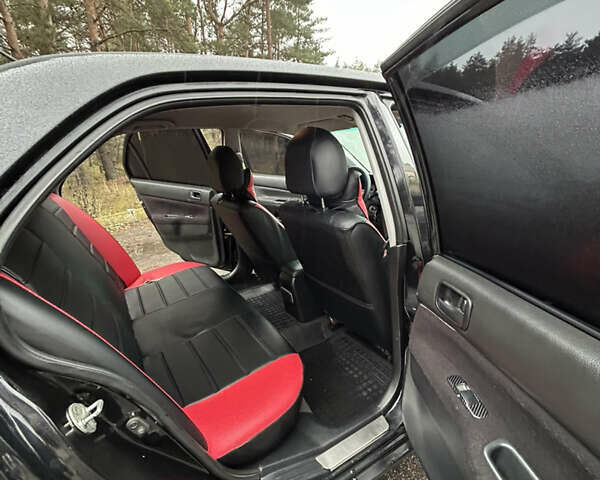 Черный Мицубиси Лансер, объемом двигателя 1.58 л и пробегом 254 тыс. км за 5000 $, фото 18 на Automoto.ua