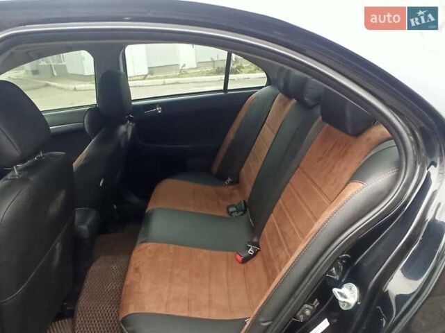 Черный Мицубиси Лансер, объемом двигателя 2 л и пробегом 195 тыс. км за 7899 $, фото 11 на Automoto.ua