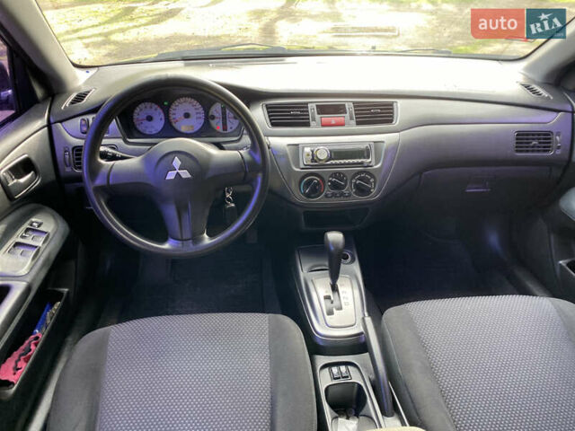 Чорний Міцубісі Lancer, об'ємом двигуна 1.6 л та пробігом 224 тис. км за 4950 $, фото 18 на Automoto.ua