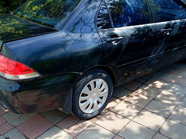 Черный Мицубиси Лансер, объемом двигателя 1.6 л и пробегом 247 тыс. км за 4000 $, фото 2 на Automoto.ua