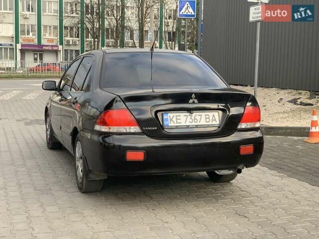 Черный Мицубиси Лансер, объемом двигателя 1.58 л и пробегом 237 тыс. км за 3850 $, фото 2 на Automoto.ua