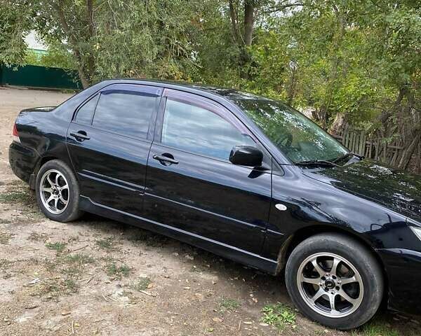 Чорний Міцубісі Lancer, об'ємом двигуна 1.58 л та пробігом 231 тис. км за 4300 $, фото 1 на Automoto.ua