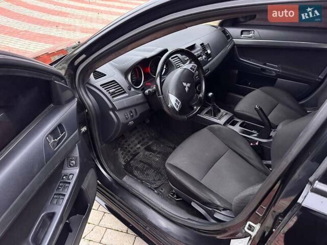 Черный Мицубиси Лансер, объемом двигателя 2 л и пробегом 217 тыс. км за 5500 $, фото 9 на Automoto.ua