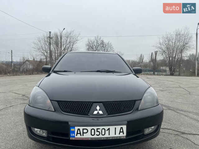 Чорний Міцубісі Lancer, об'ємом двигуна 1.58 л та пробігом 173 тис. км за 5099 $, фото 1 на Automoto.ua