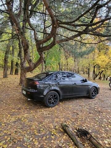 Черный Мицубиси Лансер, объемом двигателя 2 л и пробегом 260 тыс. км за 5500 $, фото 5 на Automoto.ua