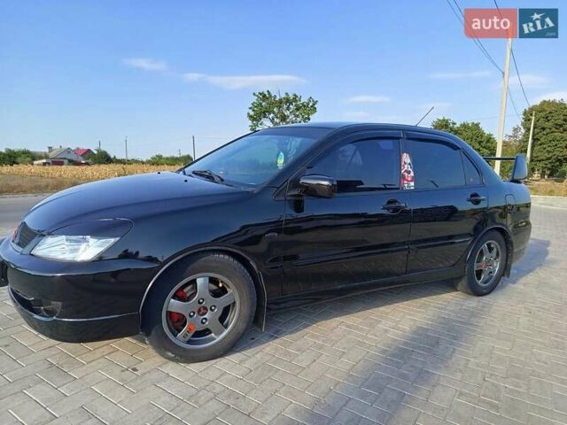 Черный Мицубиси Лансер, объемом двигателя 1.6 л и пробегом 320 тыс. км за 4500 $, фото 2 на Automoto.ua
