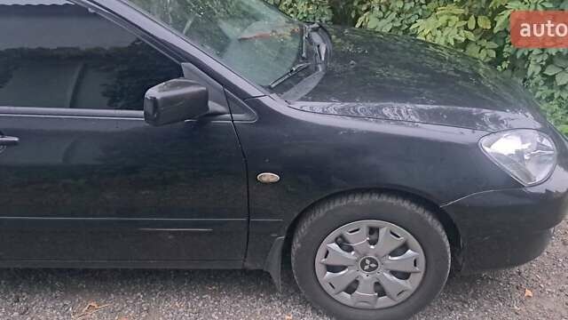 Чорний Міцубісі Lancer, об'ємом двигуна 1.6 л та пробігом 234 тис. км за 3900 $, фото 2 на Automoto.ua