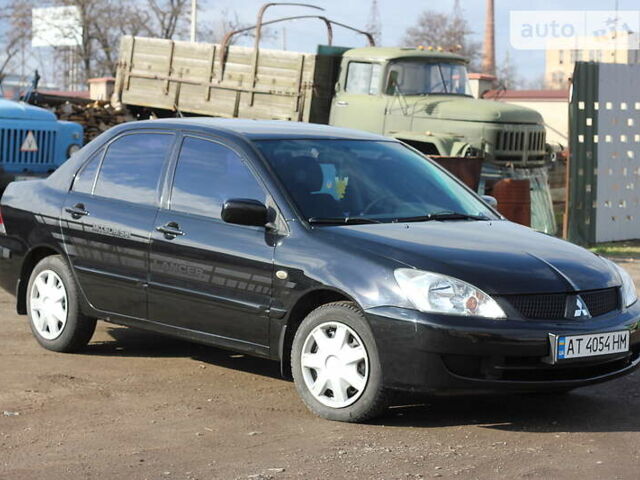 Чорний Міцубісі Lancer, об'ємом двигуна 1.6 л та пробігом 101 тис. км за 4699 $, фото 5 на Automoto.ua