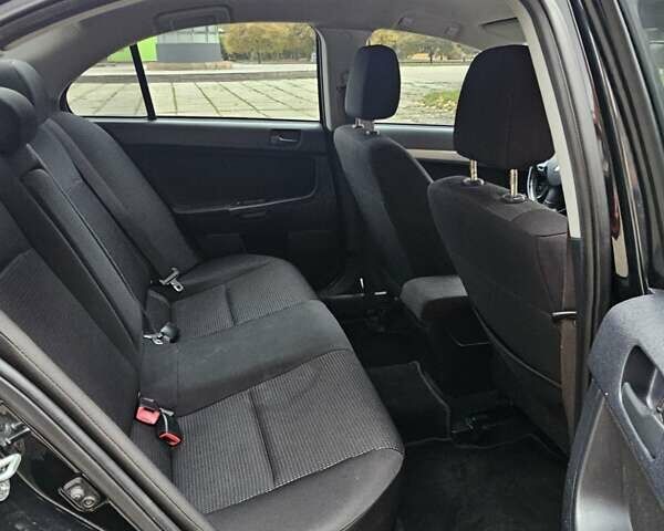 Міцубісі Lancer 2007 у Києві на Automoto.ua Чорний Міцубісі Lancer, об'ємом двигуна 2 л та пробігом 115 тис. км за 5000 $, фото 10 на Automoto.ua