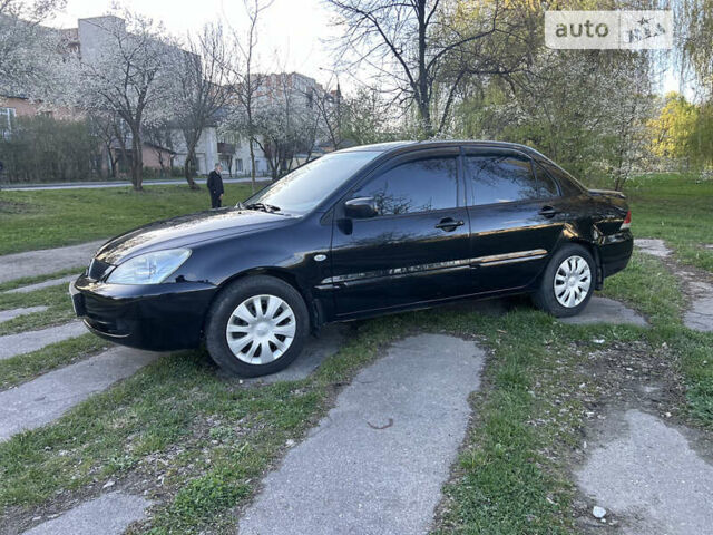 Чорний Міцубісі Lancer, об'ємом двигуна 1.58 л та пробігом 161 тис. км за 5300 $, фото 5 на Automoto.ua