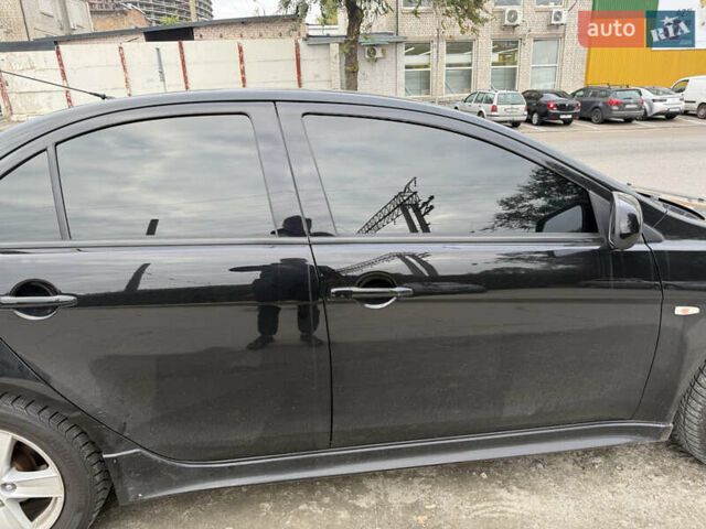 Черный Мицубиси Лансер, объемом двигателя 2 л и пробегом 183 тыс. км за 7800 $, фото 14 на Automoto.ua