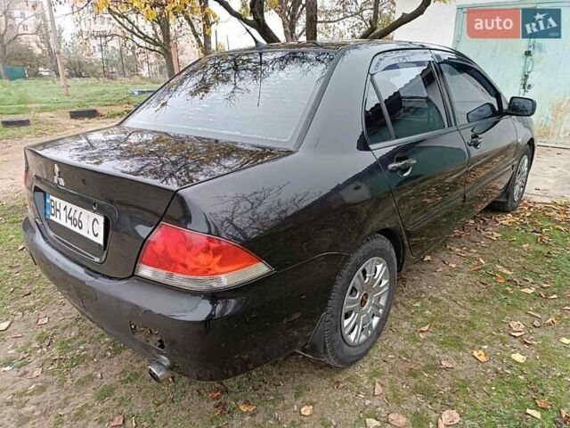 Чорний Міцубісі Lancer, об'ємом двигуна 1.58 л та пробігом 227 тис. км за 4100 $, фото 3 на Automoto.ua