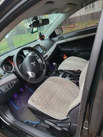 Черный Мицубиси Лансер, объемом двигателя 2 л и пробегом 260 тыс. км за 5500 $, фото 2 на Automoto.ua