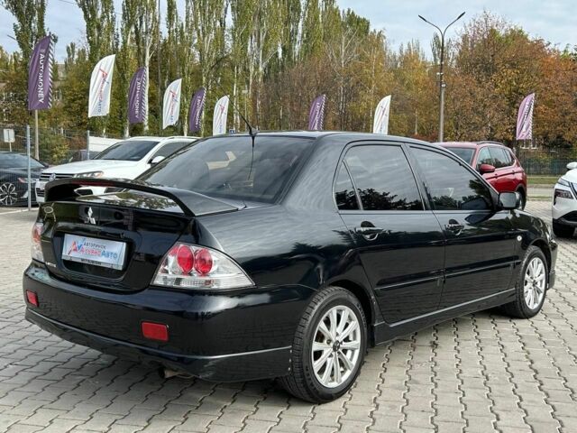 Мицубиси Лансер 2007 в Кривом Роге на Automoto.ua Черный Мицубиси Лансер, объемом двигателя 2 л и пробегом 143 тыс. км за 5400 $, фото 5 на Automoto.ua