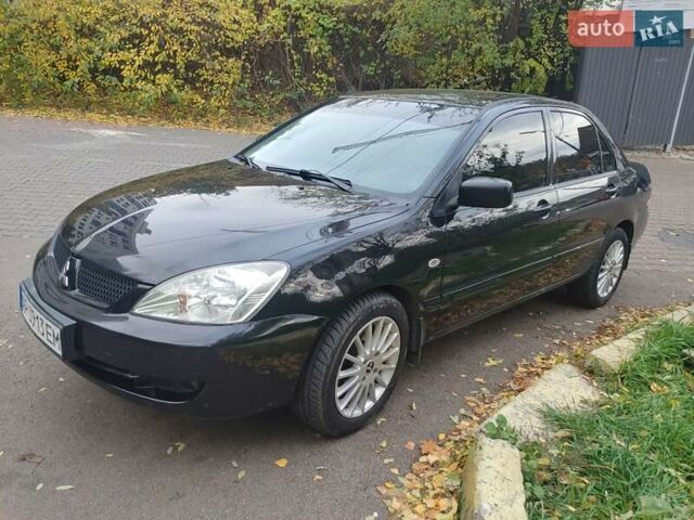 Чорний Міцубісі Lancer, об'ємом двигуна 1.58 л та пробігом 190 тис. км за 3750 $, фото 16 на Automoto.ua