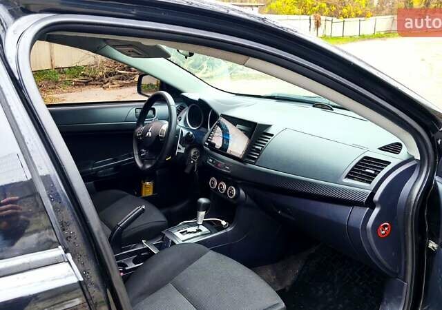 Черный Мицубиси Лансер, объемом двигателя 2 л и пробегом 230 тыс. км за 7100 $, фото 3 на Automoto.ua