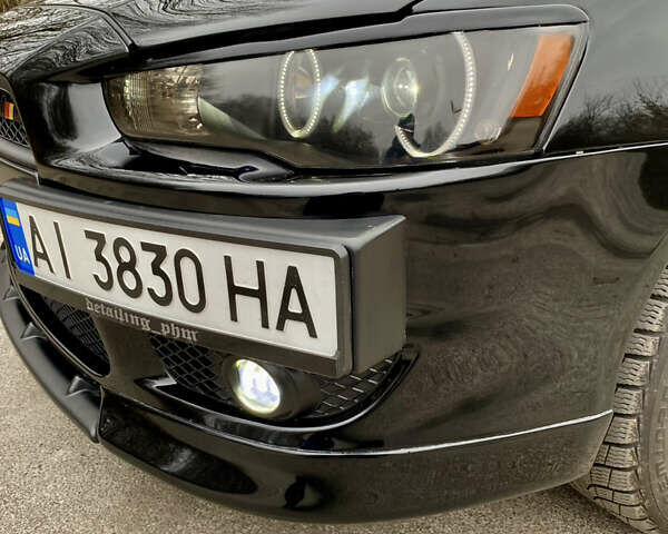 Черный Мицубиси Лансер, объемом двигателя 2 л и пробегом 164 тыс. км за 8300 $, фото 5 на Automoto.ua