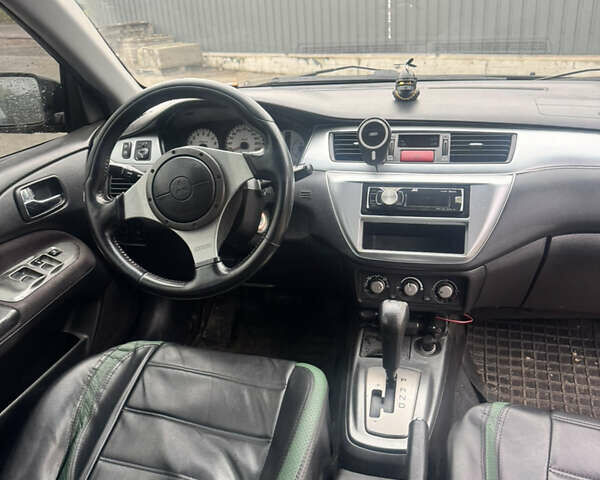 Чорний Міцубісі Lancer, об'ємом двигуна 2 л та пробігом 210 тис. км за 5500 $, фото 23 на Automoto.ua