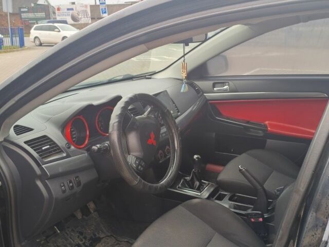 Черный Мицубиси Лансер, объемом двигателя 2 л и пробегом 160 тыс. км за 8000 $, фото 9 на Automoto.ua