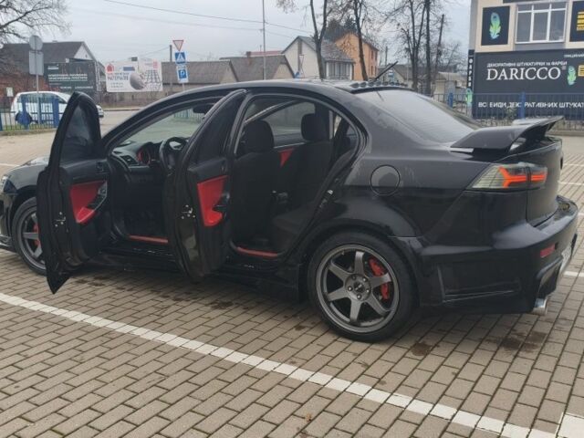 Черный Мицубиси Лансер, объемом двигателя 2 л и пробегом 160 тыс. км за 8000 $, фото 7 на Automoto.ua