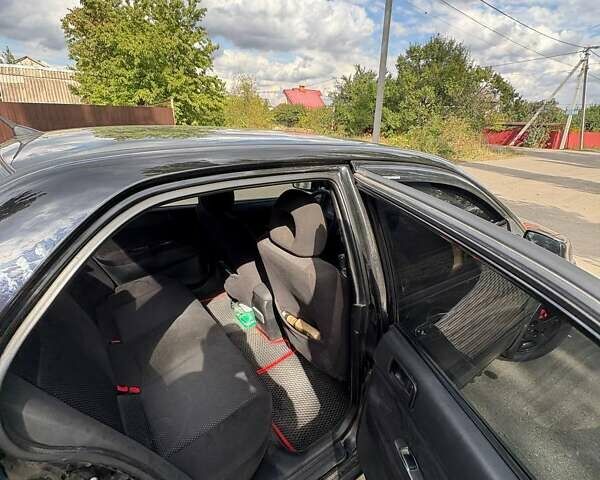 Черный Мицубиси Лансер, объемом двигателя 1.6 л и пробегом 244 тыс. км за 4100 $, фото 2 на Automoto.ua