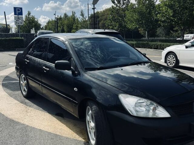 Чорний Міцубісі Lancer, об'ємом двигуна 1.6 л та пробігом 228 тис. км за 3300 $, фото 5 на Automoto.ua