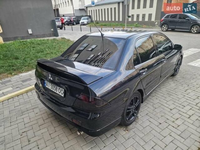 Чорний Міцубісі Lancer, об'ємом двигуна 2 л та пробігом 272 тис. км за 4750 $, фото 10 на Automoto.ua