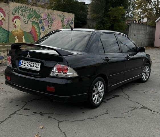 Чорний Міцубісі Lancer, об'ємом двигуна 2 л та пробігом 143 тис. км за 5400 $, фото 3 на Automoto.ua