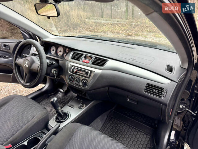 Черный Мицубиси Лансер, объемом двигателя 1.6 л и пробегом 216 тыс. км за 4990 $, фото 18 на Automoto.ua