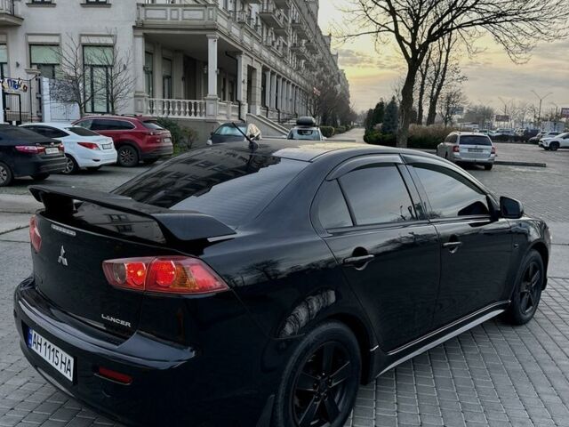 Черный Мицубиси Лансер, объемом двигателя 2 л и пробегом 242 тыс. км за 6200 $, фото 10 на Automoto.ua