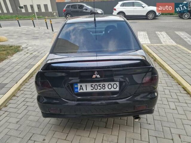 Чорний Міцубісі Lancer, об'ємом двигуна 2 л та пробігом 272 тис. км за 4750 $, фото 11 на Automoto.ua