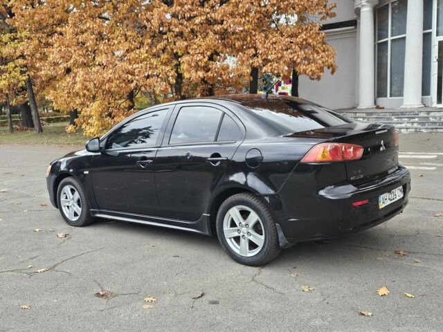 Черный Мицубиси Лансер, объемом двигателя 2 л и пробегом 115 тыс. км за 5000 $, фото 4 на Automoto.ua