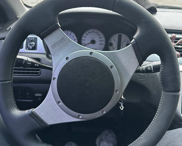 Черный Мицубиси Лансер, объемом двигателя 2 л и пробегом 260 тыс. км за 5300 $, фото 19 на Automoto.ua