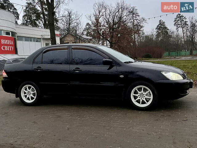 Чорний Міцубісі Lancer, об'ємом двигуна 1.6 л та пробігом 303 тис. км за 4350 $, фото 3 на Automoto.ua